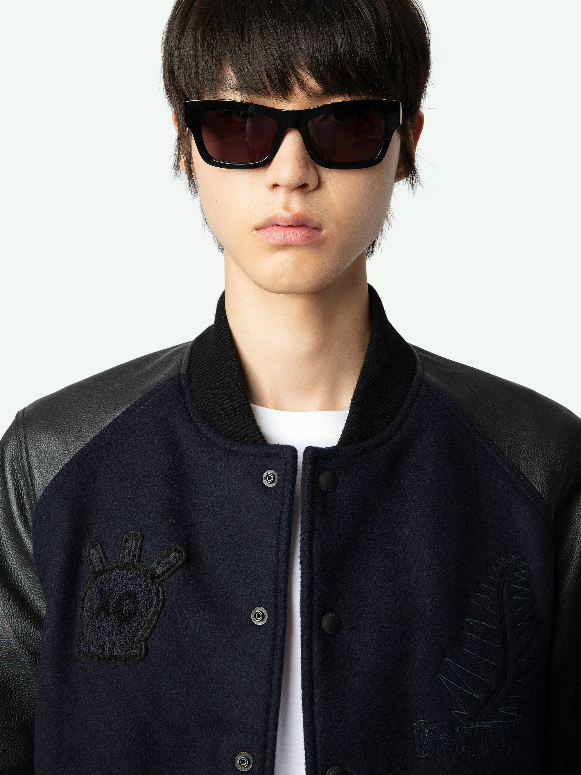 Birdieh Bomber Jacket - Blue wool bomber jacket with patterned grained leather pockets and panels, embroidery and XO skull badge.